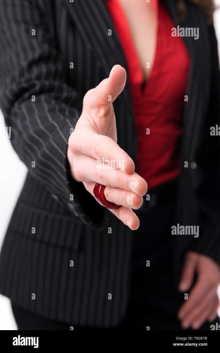 Close up of a young Business woman in a black suit with outstreched hand Stock Photo