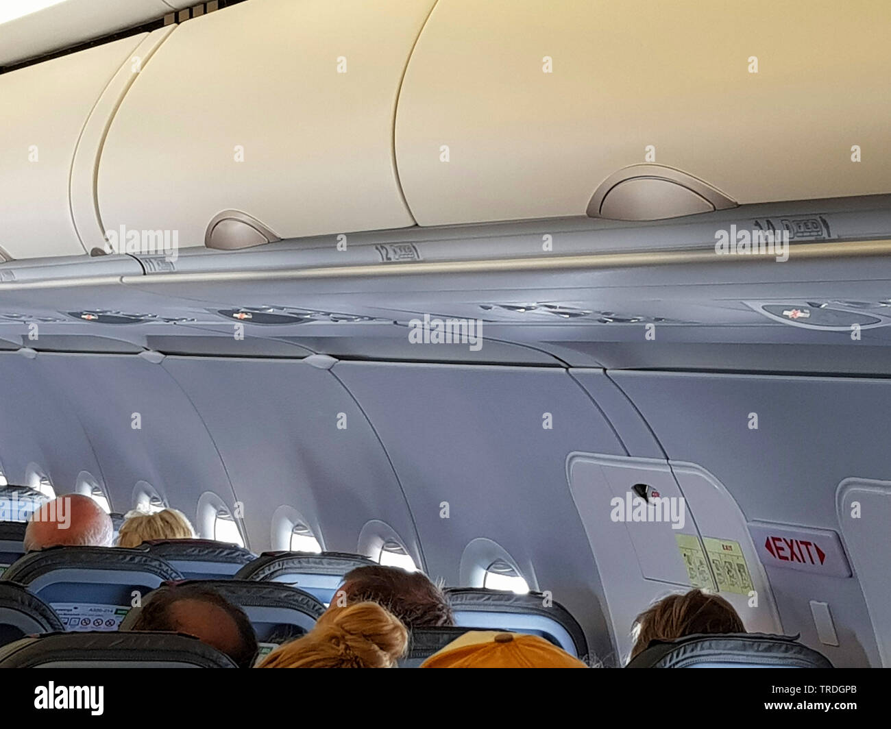 overhead locker in a passenger; aircraft, without number 13 Stock Photo
