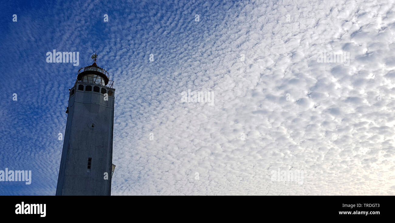 Noordwijk lighthouse and clouds, Altocumulus stratiformis , Netherlands, Noordwijk aan Zee Stock Photo