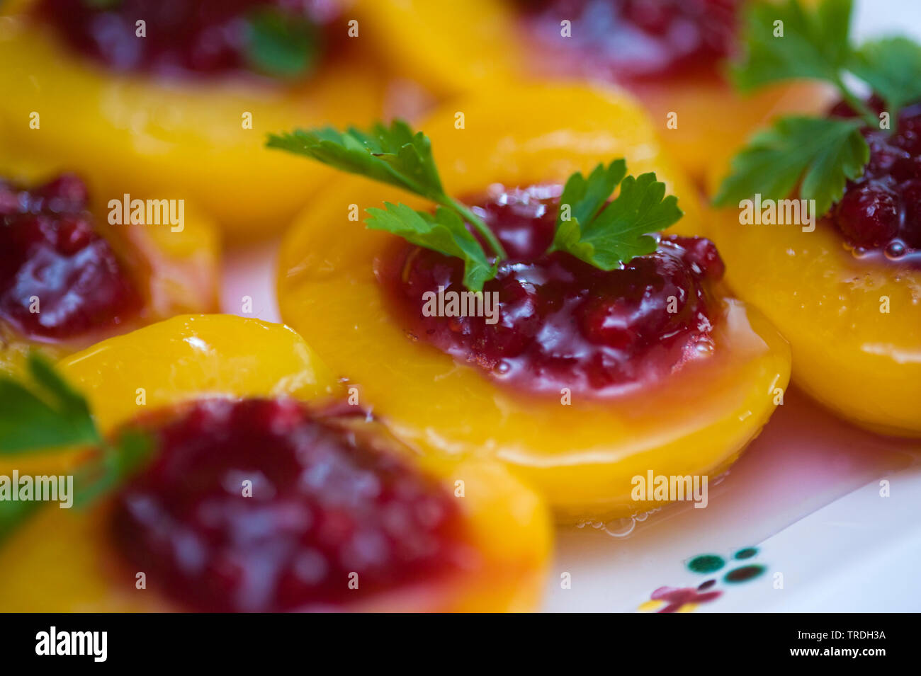 peaches filled with cranberries Stock Photo
