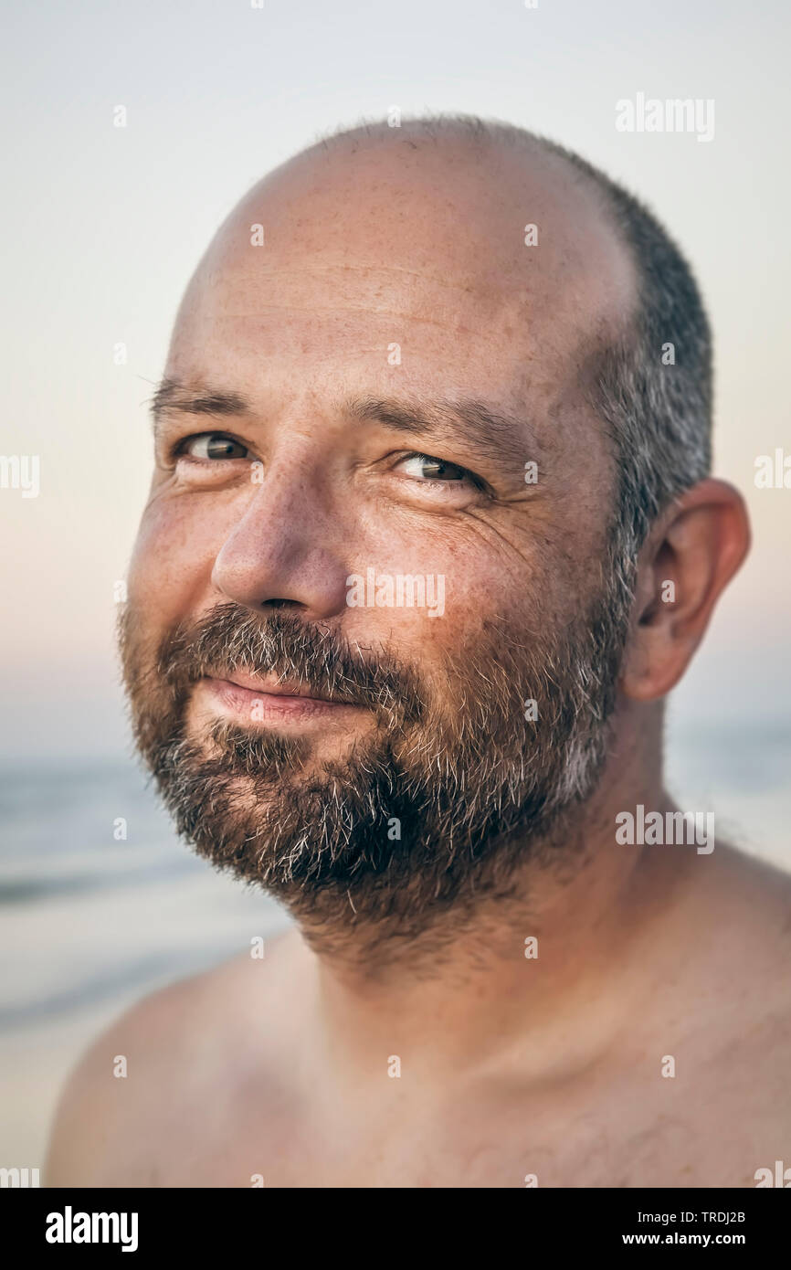 Bald man on beach hi-res stock photography and images - Alamy