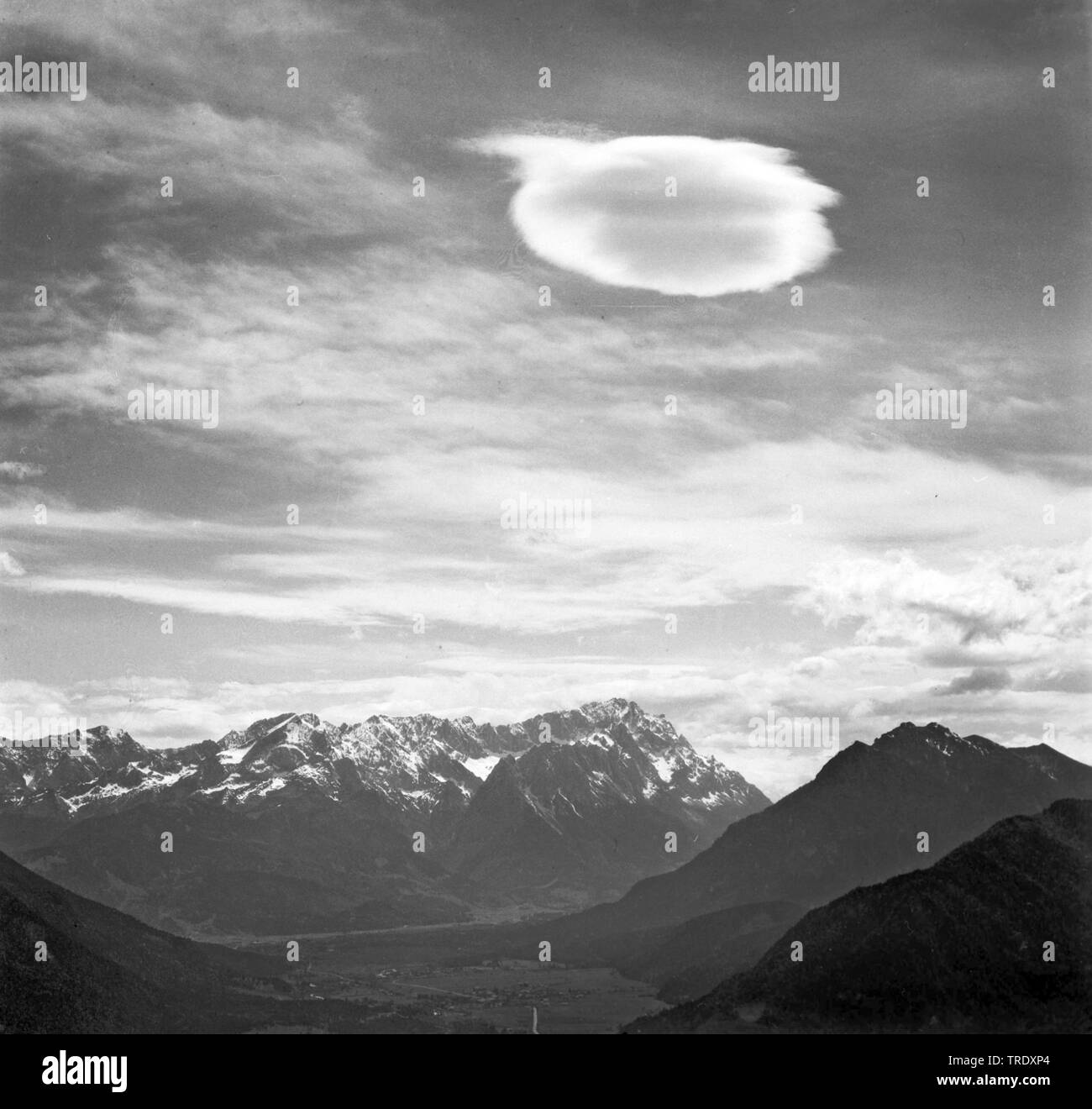 lenticular cloud over mountain Zugspitze, aerial photo from the year 1961, Germany, Bavaria Stock Photo
