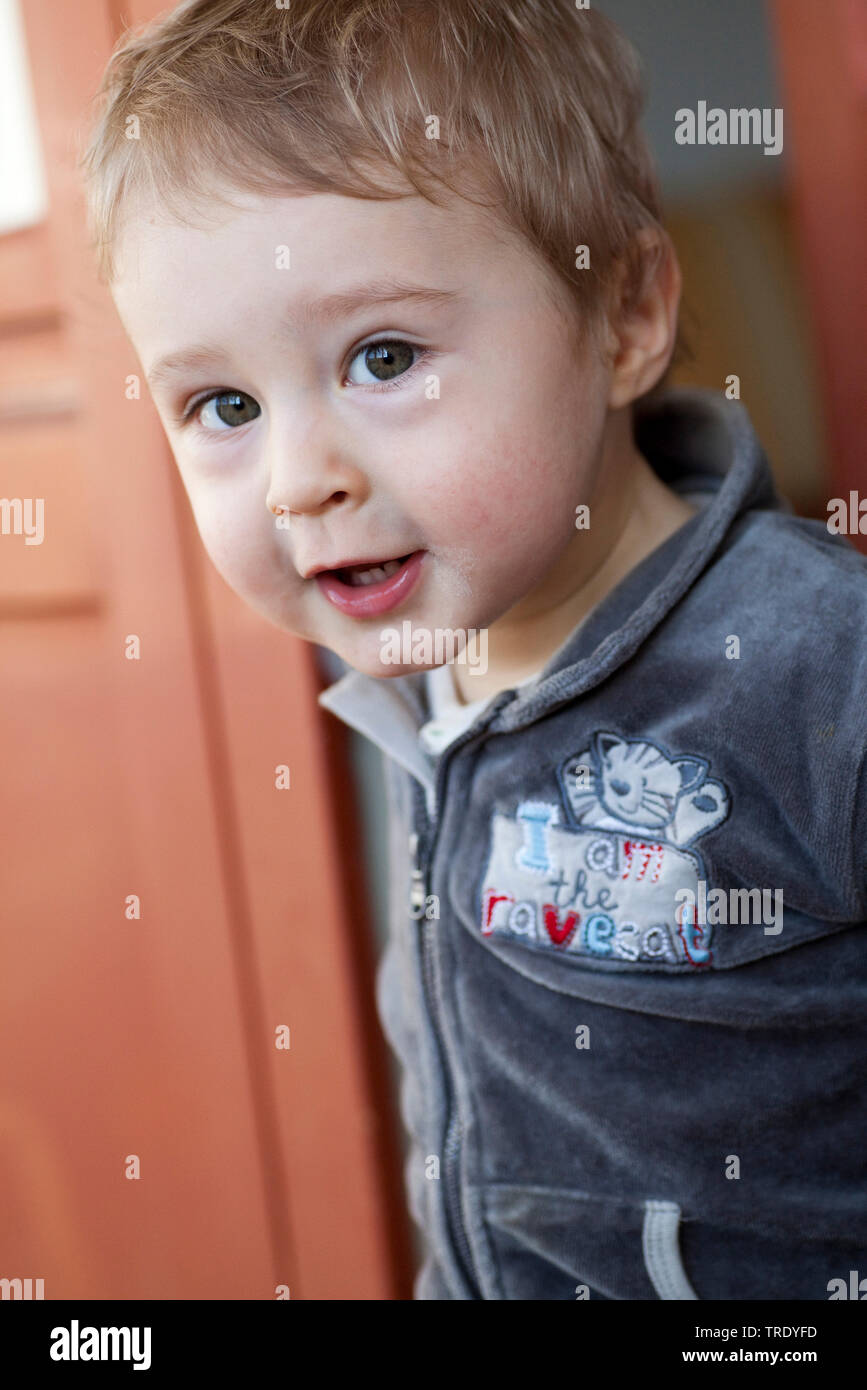 Portrait of a young boy curiously looking into the camera Stock Photo