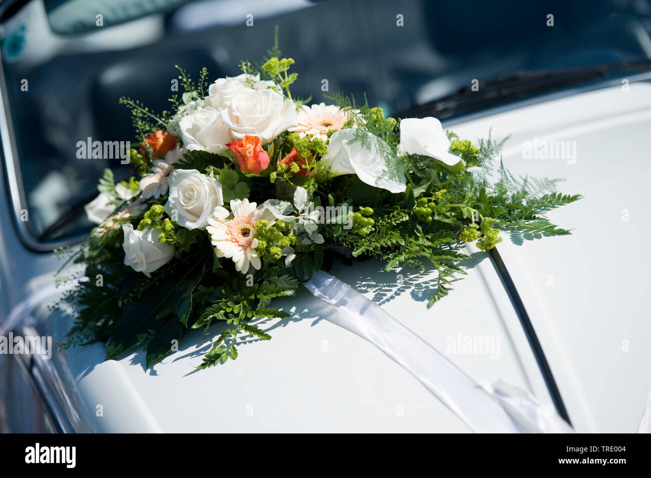 Detail of a bouquet of flowers fixed on a bonnet - wedding Stock Photo