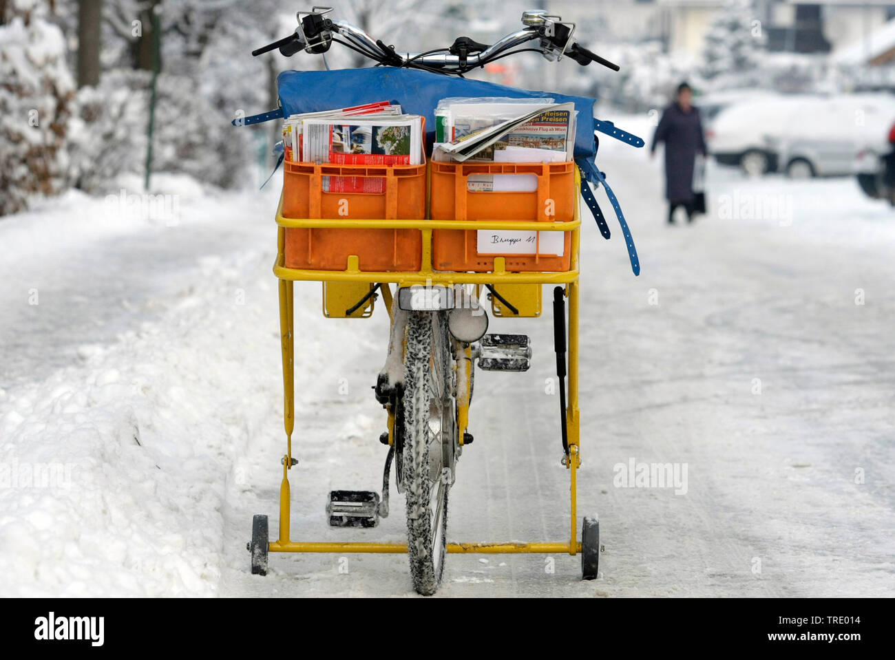 Postman's bike of the austrian Federal Mail on a snow-covered road, Austria Stock Photo