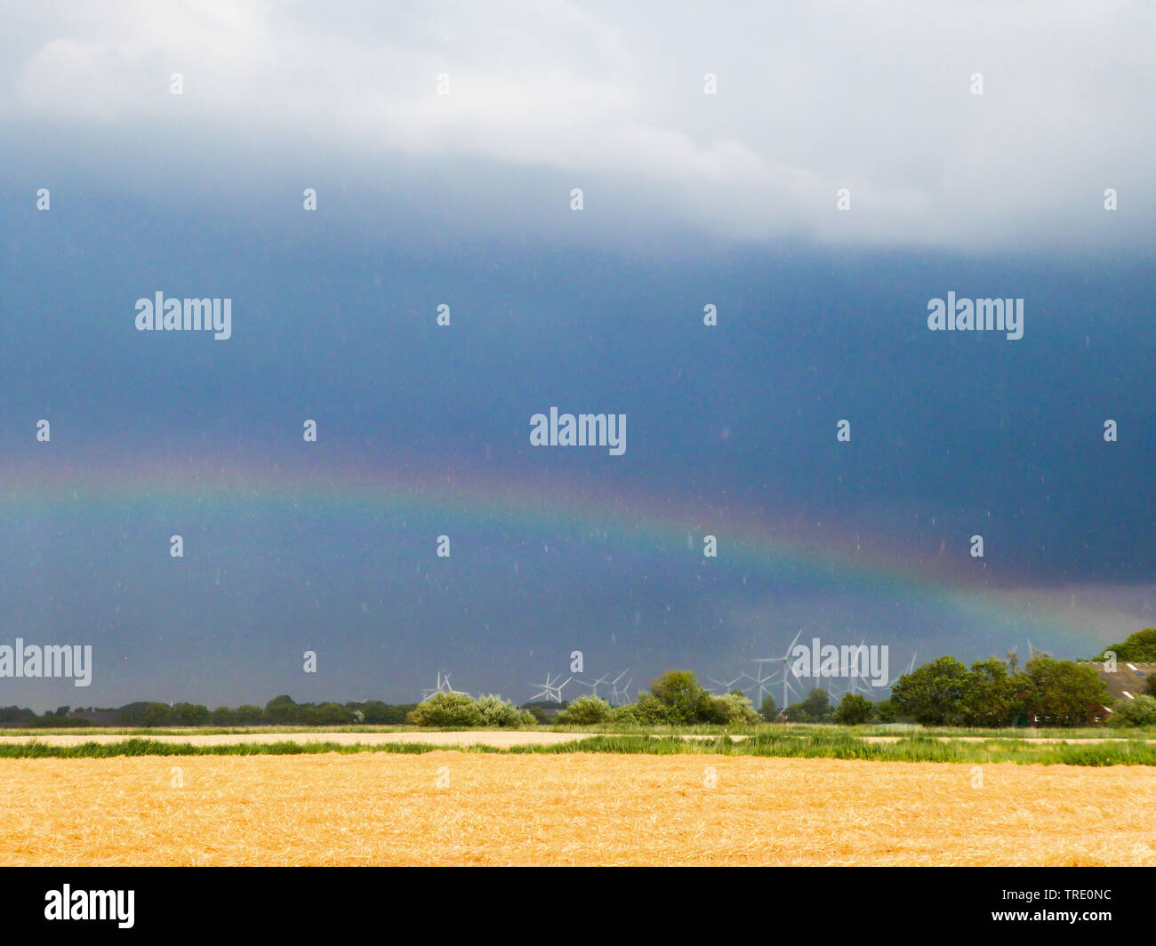 rainbow over wind park, Germany, Lower Saxony, Norddeich Stock Photo