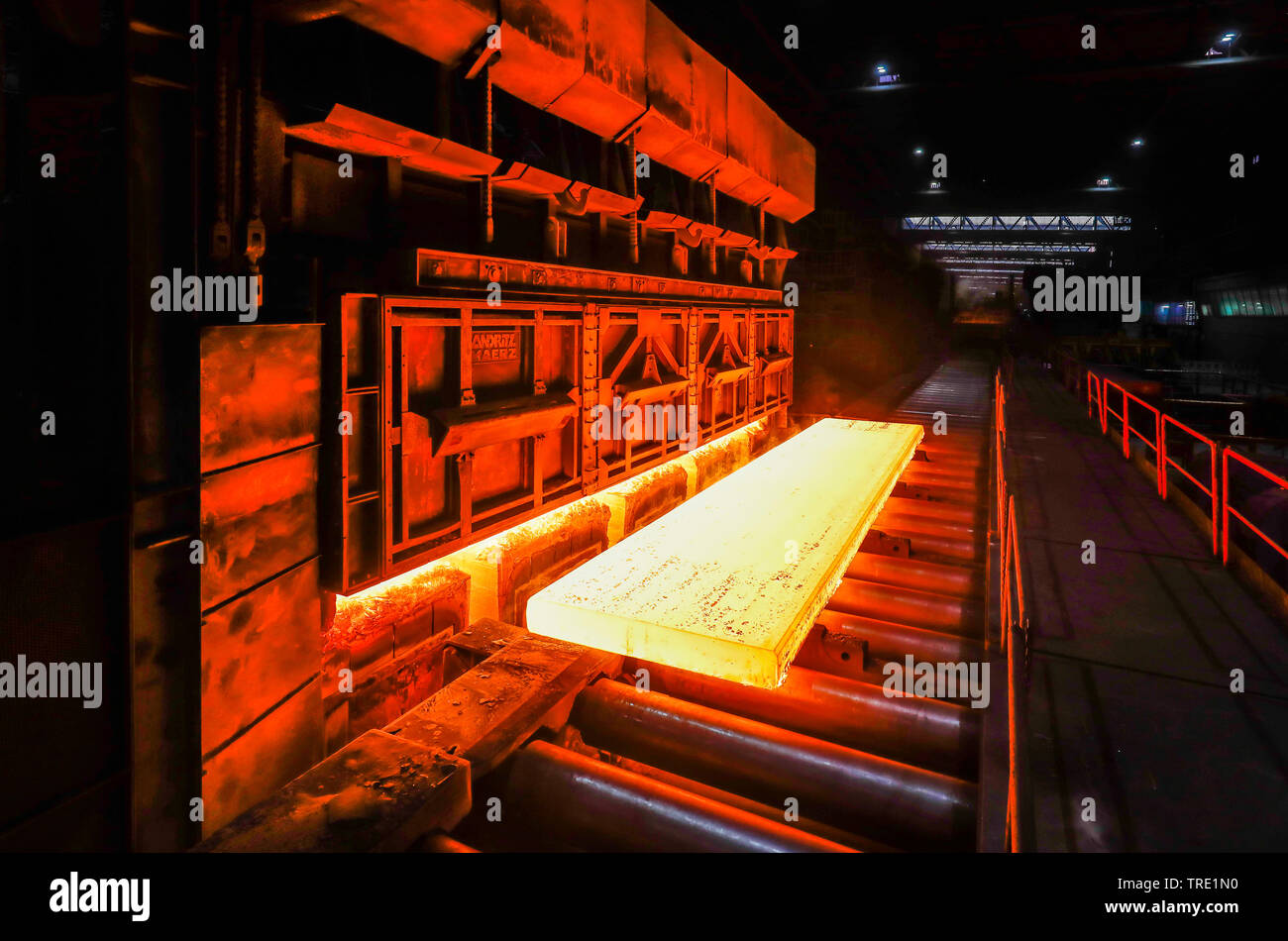 Duisburg, Ruhr area, North Rhine-Westphalia, Germany - ThyssenKrupp Steel Europe, steel production in a steel mill, here glowing steel slabs in a hot Stock Photo