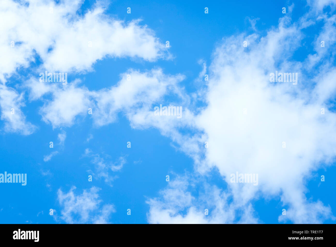 blue sky with white clouds in sunlight Stock Photo