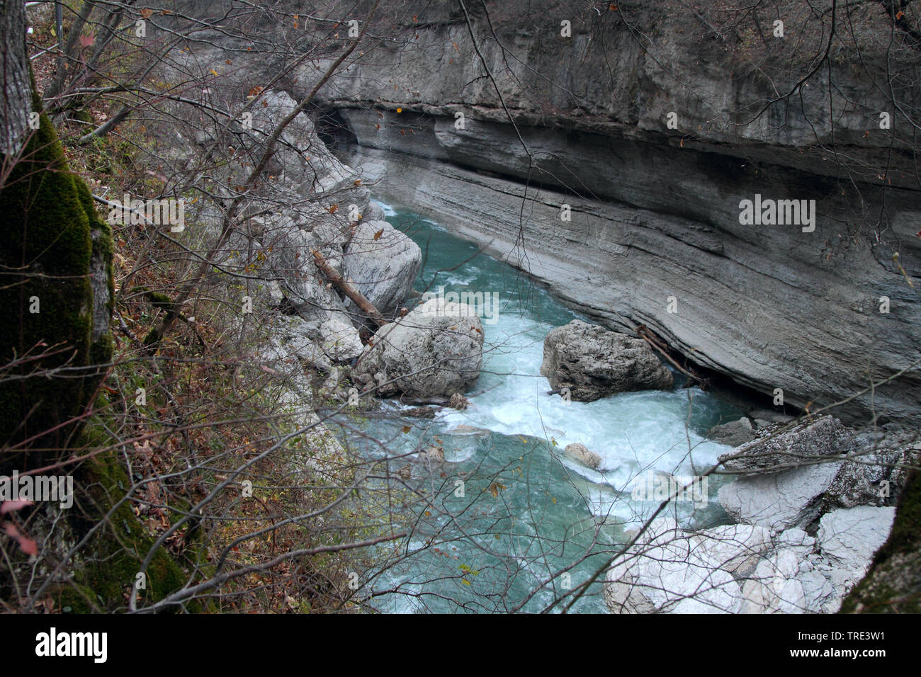 Turbulent stream flows among the cliffs in the Khadzhokhskaya gorge. Stock Photo