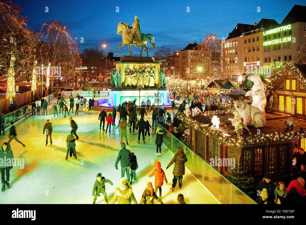 ice skating on the Heumarkt with illuminated equestrian statue of Friedrich Wilhelm III., Germany, North Rhine-Westphalia, Cologne Stock Photo
