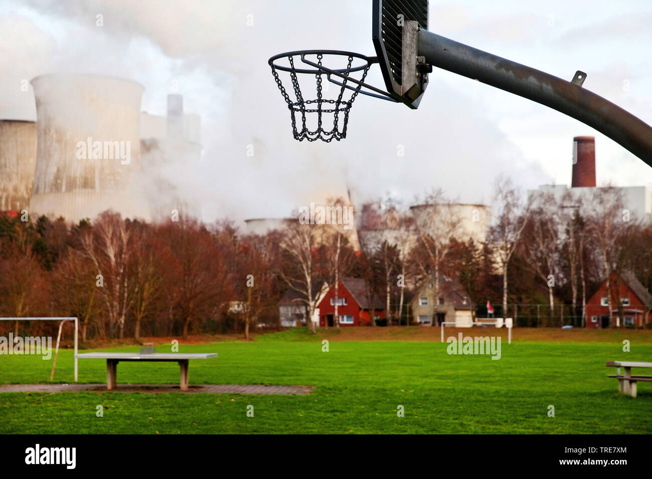 desolate sports ground of district Auenheim in front of brown coal power station Niederaussem, Germany, North Rhine-Westphalia, Bergheim Stock Photo