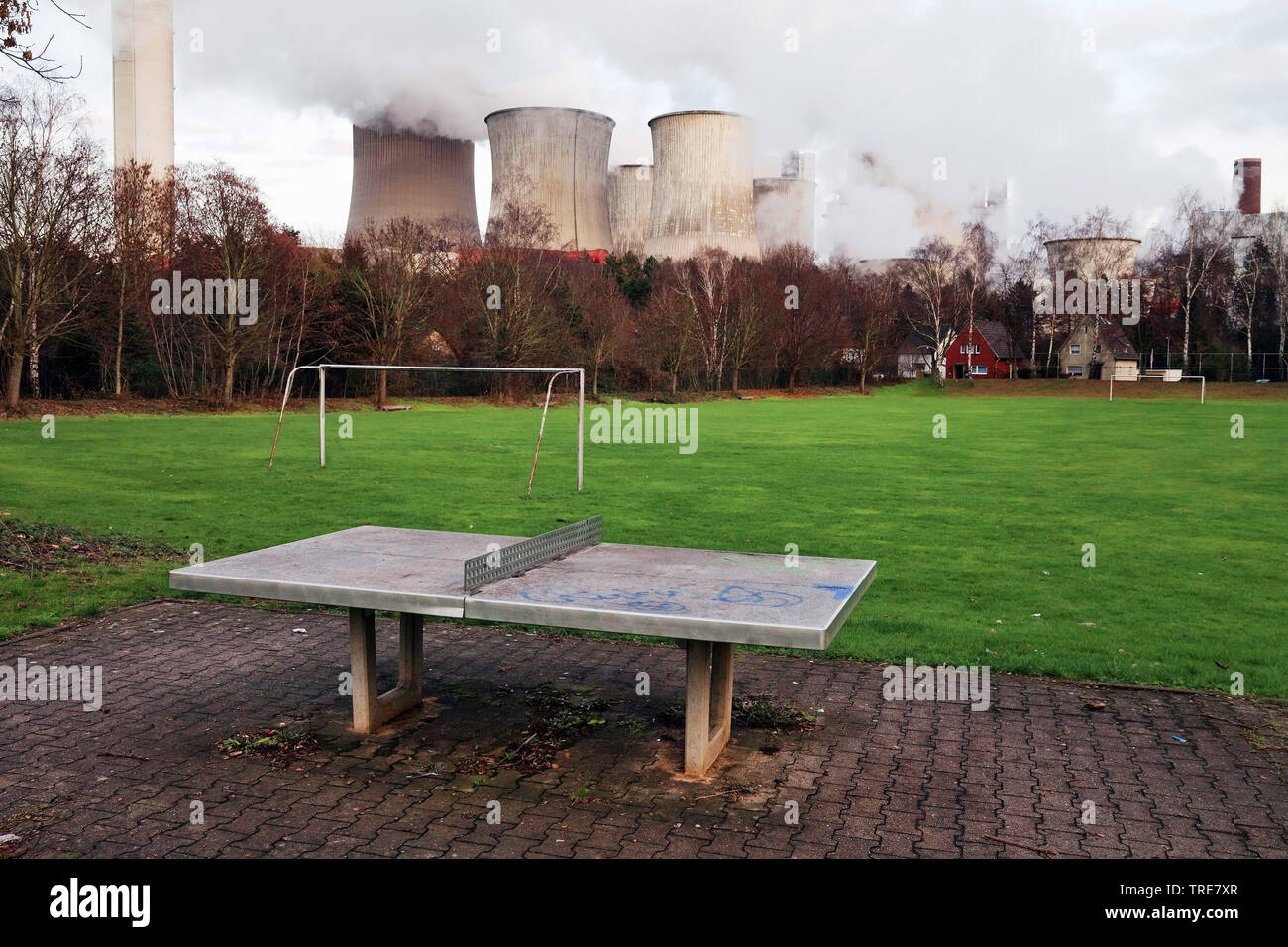desolate sports ground of district Auenheim in front of brown coal power station Niederaussem, Germany, North Rhine-Westphalia, Bergheim Stock Photo