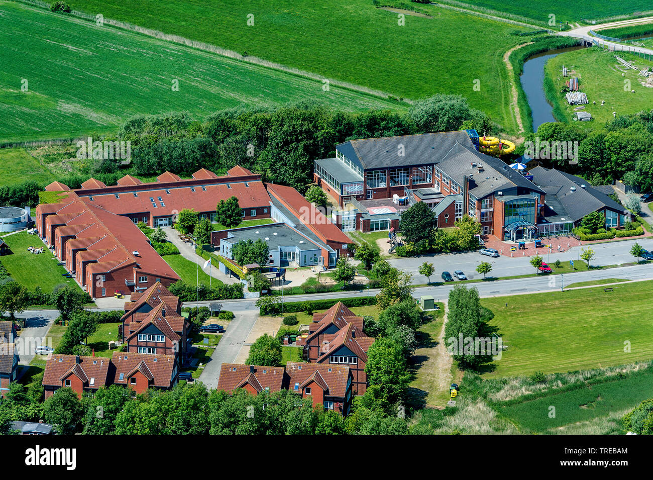 waterpark Pellewelle and house of the German Red Cross on the island Pellworm, aerial view, Germany, Schleswig-Holstein, Northern Frisia Stock Photo