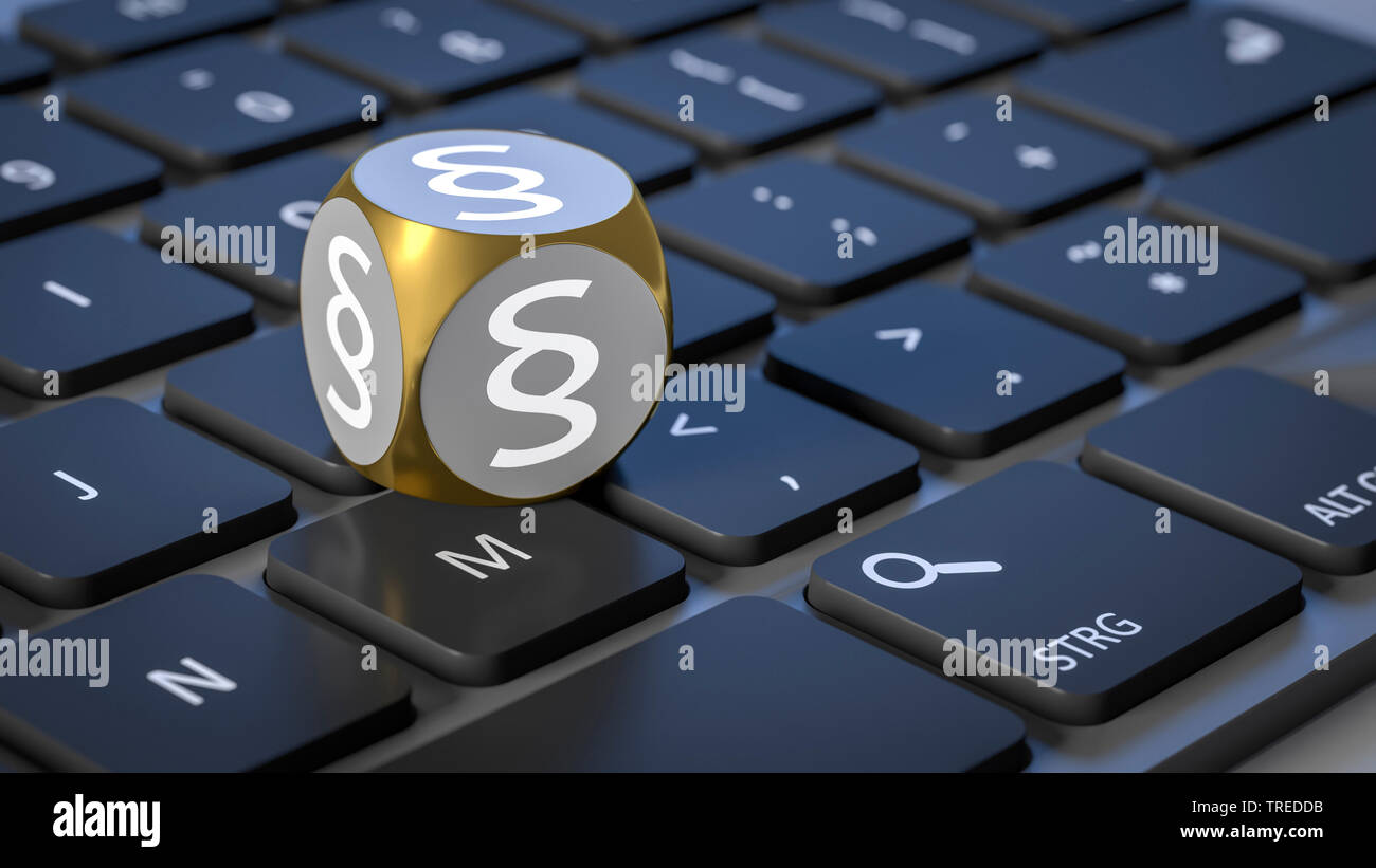 Grey dice with law paragraph symbols on a black keyboard Stock Photo