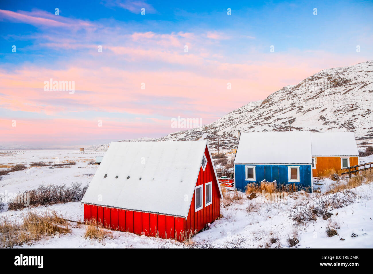 colorful frame houses in snow, Greenland Stock Photo