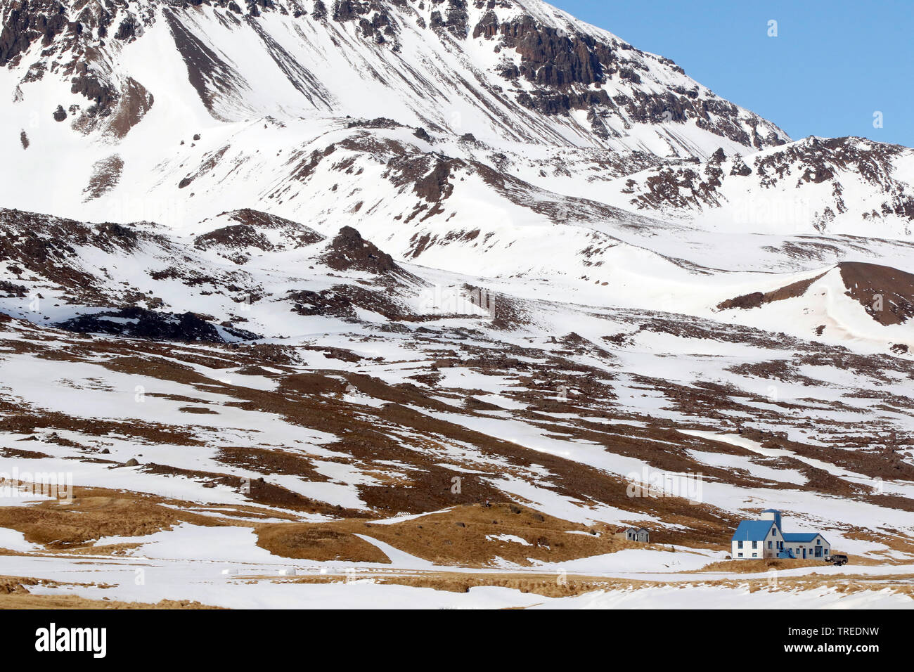 house at the foot of a mountian, Iceland Stock Photo