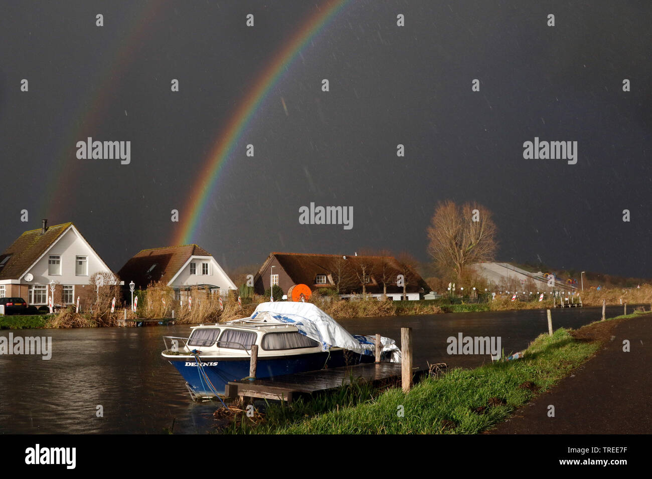 rain cloud and double rainbow, Netherlands, South Holland, Ommoord Stock Photo