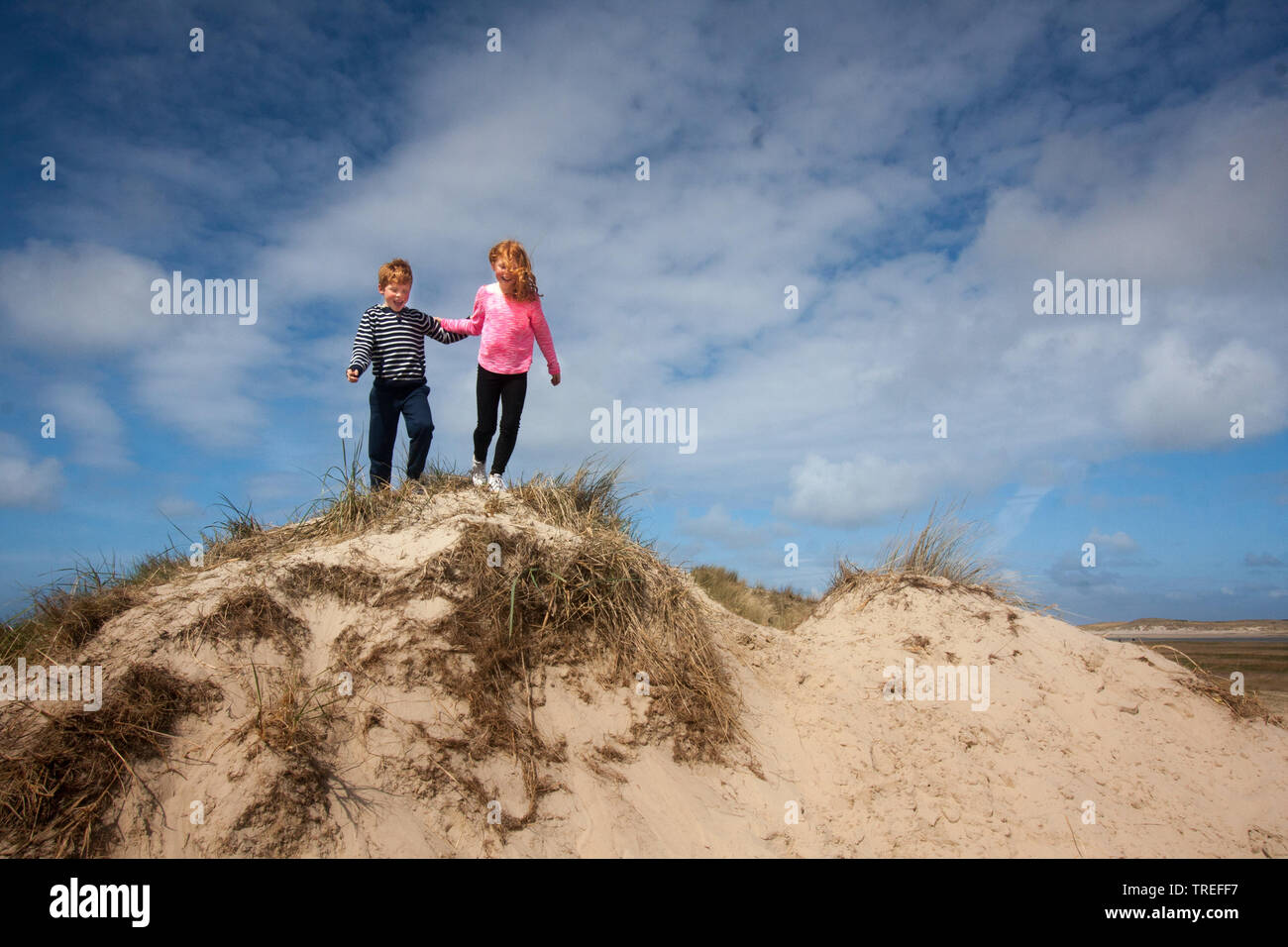 two kids in the dunes on Texel, Netherlands, Texel, De Slufter Stock Photo