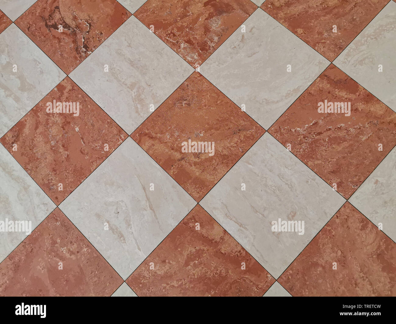 red and white tiles medieval floor background Stock Photo