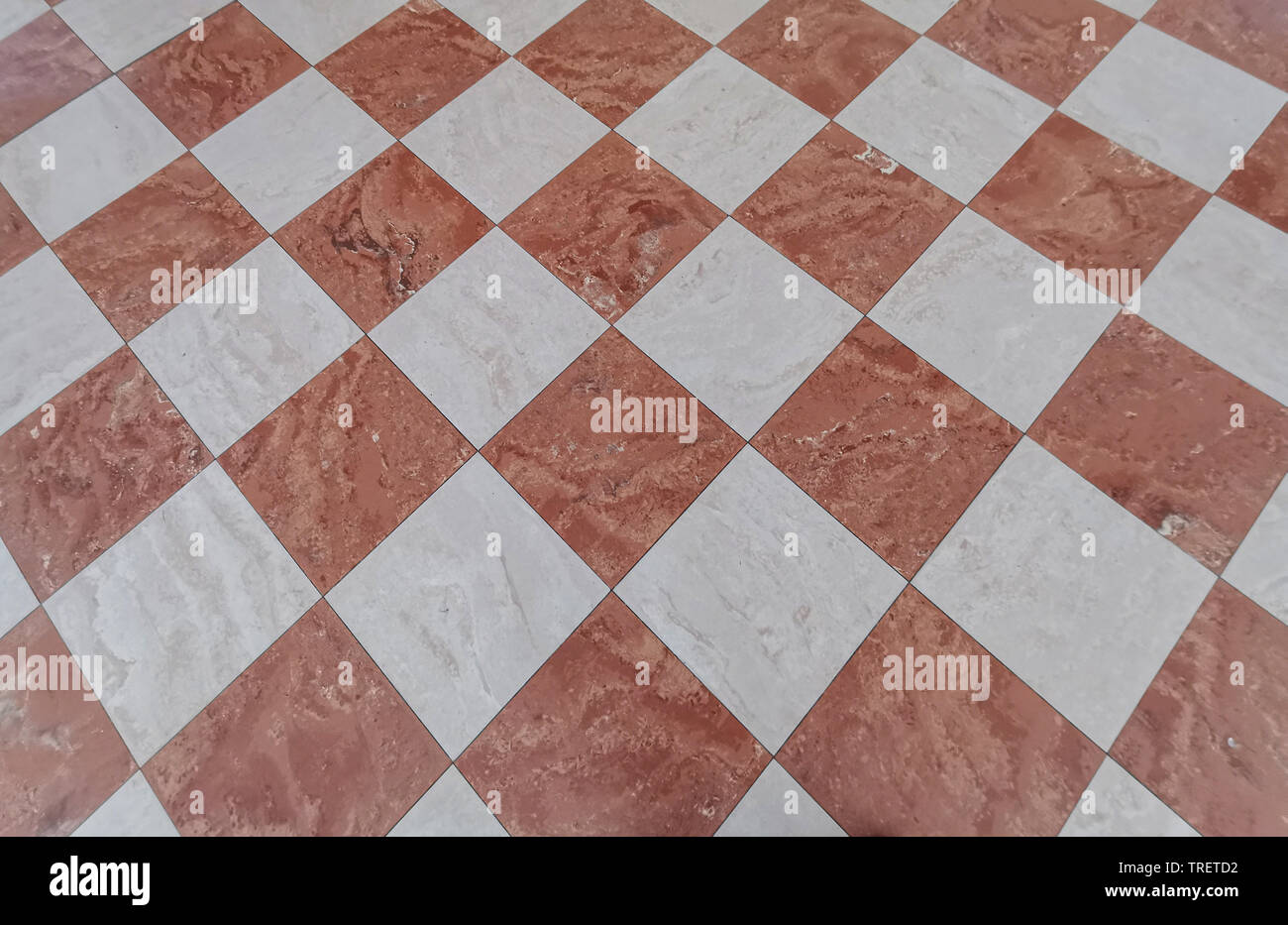 red and white tiles medieval floor background Stock Photo