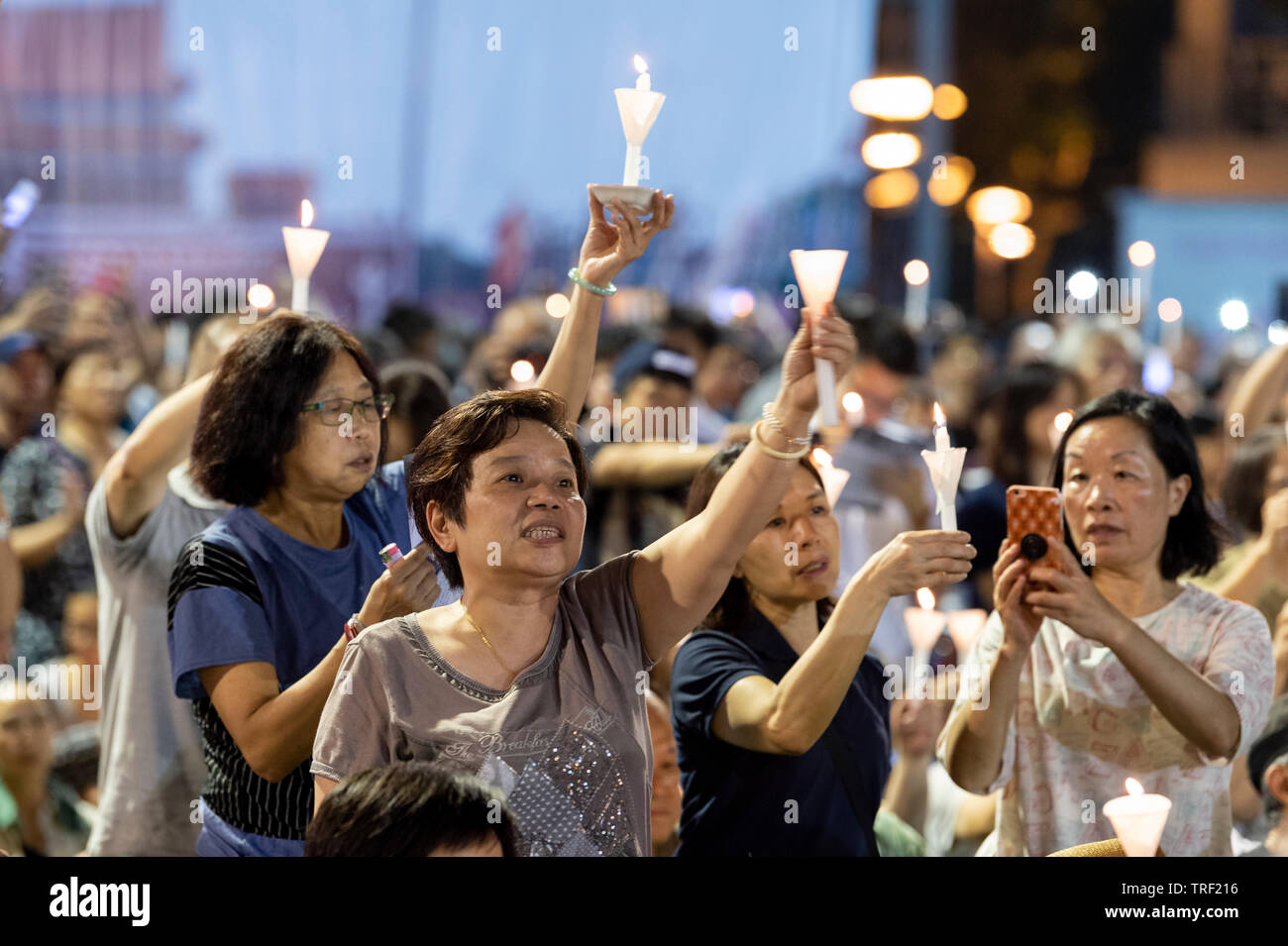 Hong Kong. 04th June, 2019. A candlelit vigil takes place in Hong Kong’s Victoria Park to mark the 30th Anniversary of the Tiananmen Square massacre in Beijing China in 1989. As the only location on Chinese soli that such a rally is allowed, the crowds are overflowing people fear the ever deteriorating human rights in China. Alamy Live News Credit: Jayne Russell/Alamy Live News Stock Photo