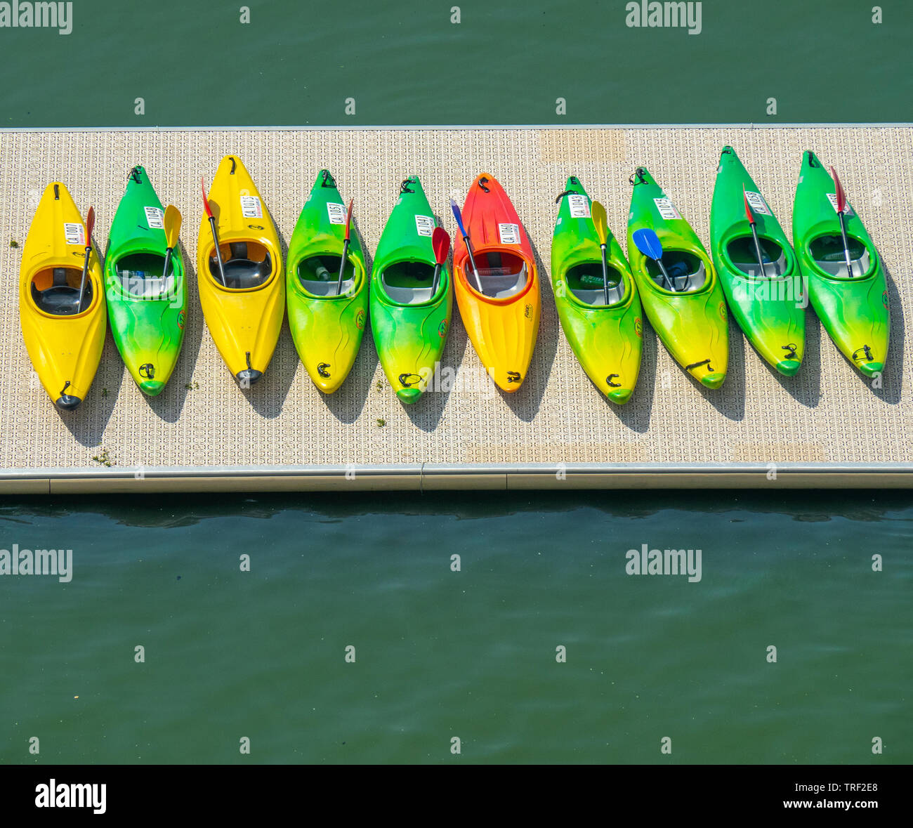 Row of kayaks on a pontoon Stock Photo - Alamy