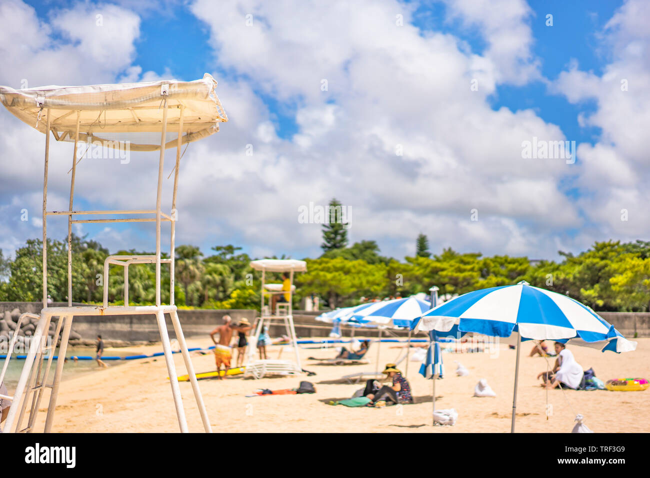 Beach Umbrellas And Lifeguard Chairs On The Sandy Beach Naminoue