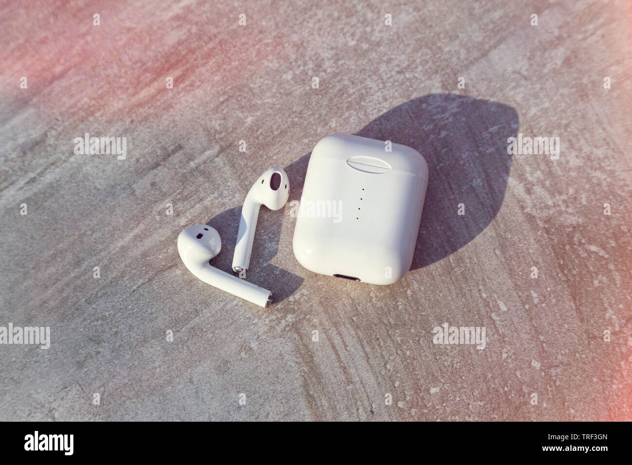 White Wireless Earphone with Case Top View Close Up Capture Stock Photo