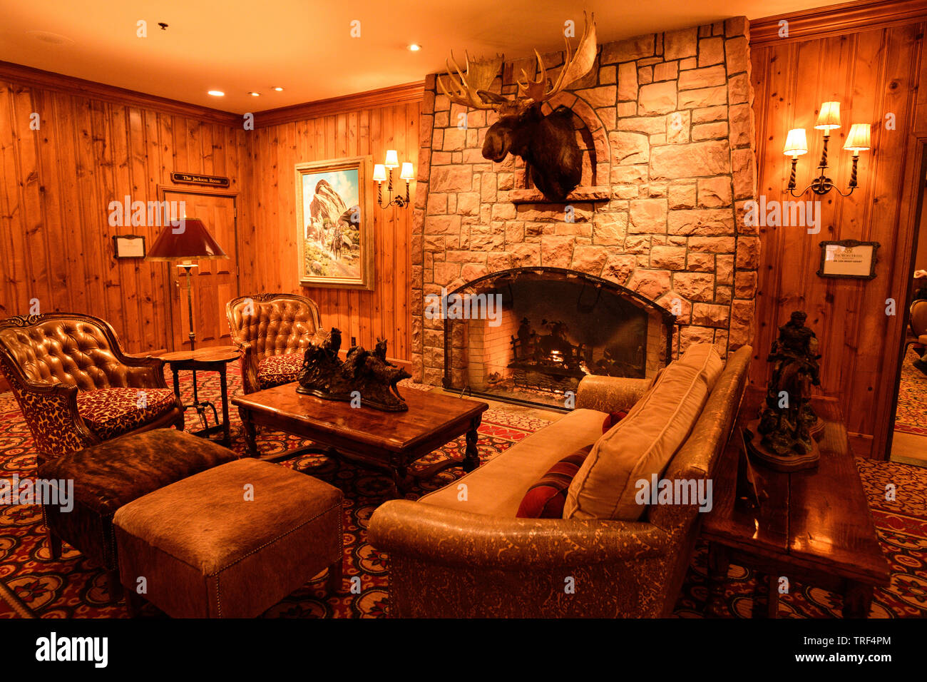 The luxurious fireplace and moose head in the lobby of the historic