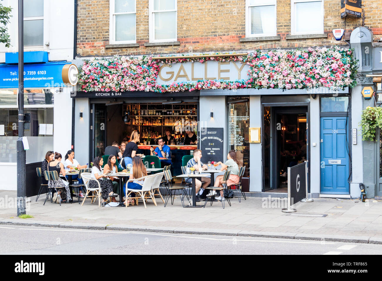 Alfresco diners outside the Galley restaurant on Upper Street, London, UK Stock Photo