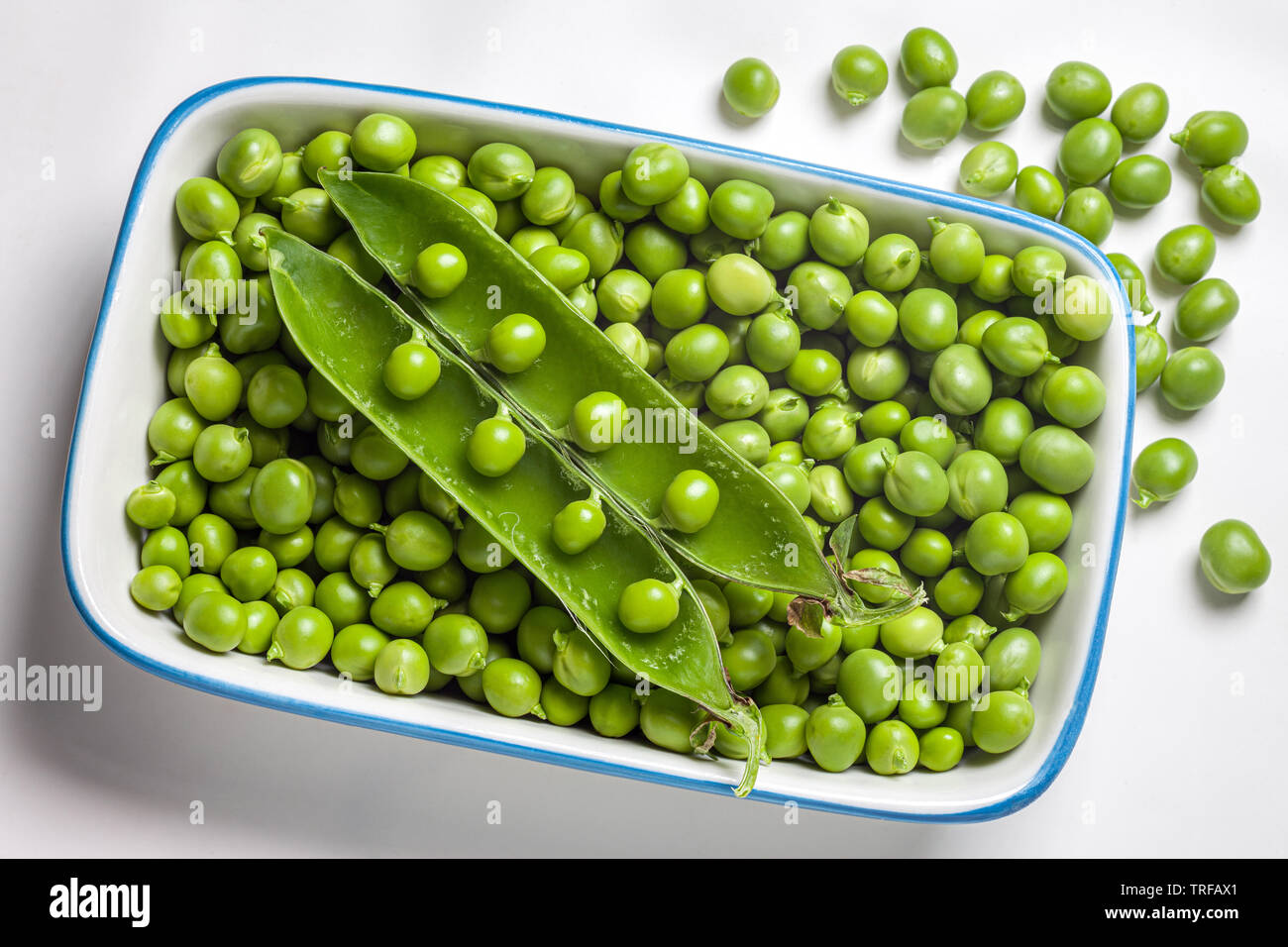 bowl with fresh peas raw Stock Photo