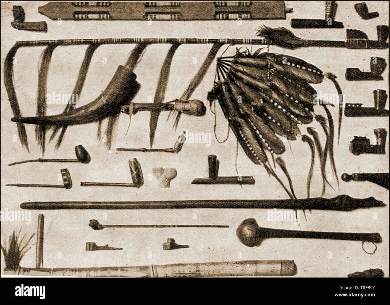 1909 illustration showing native American Indian weapons,artifacts and smoking equipment. Stock Photo