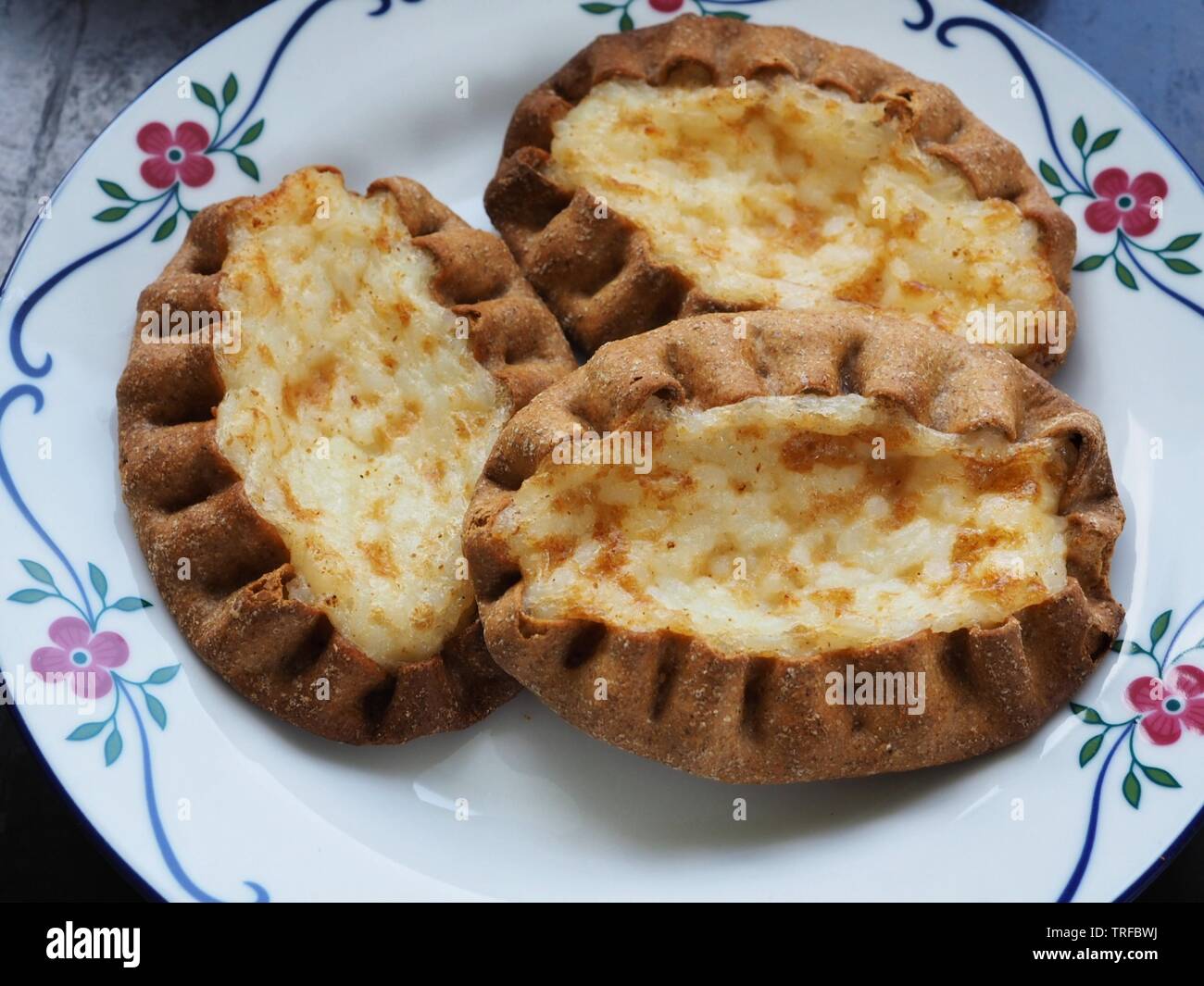 Traditional Finnish Karelian pies on a plate Stock Photo