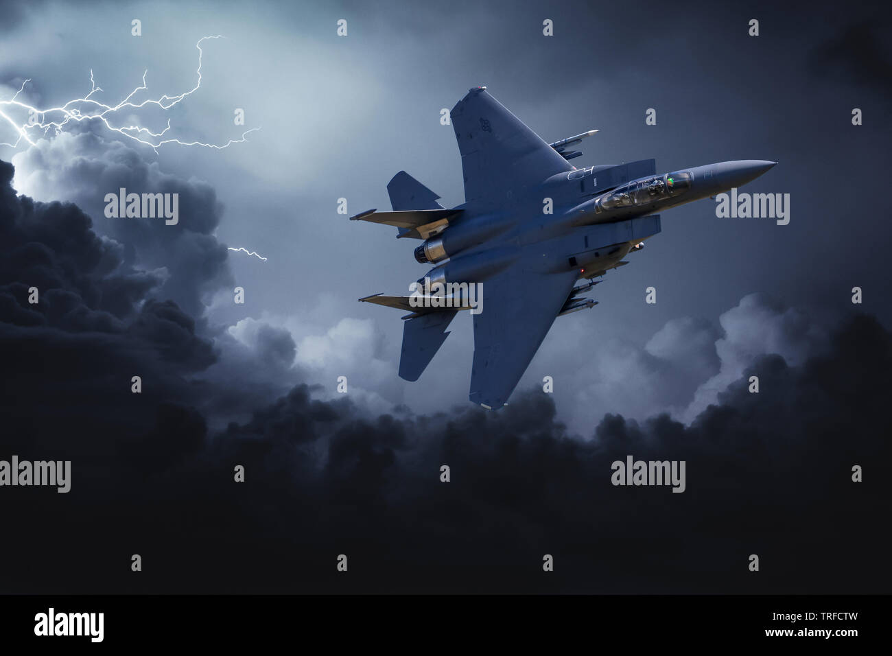 F-15 Strike Eagle. A composite image of a USAF F-15 flying through stormy skies. Stock Photo