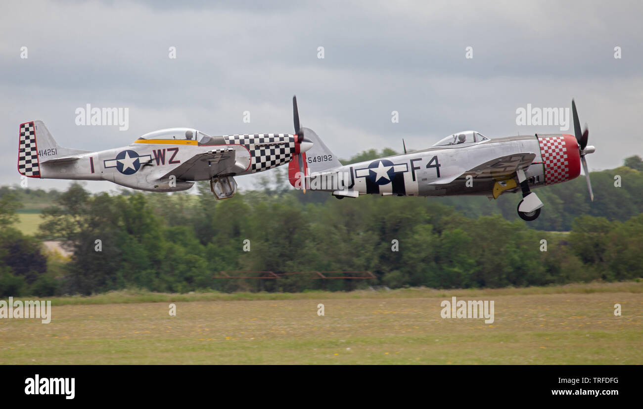 Republic P-47D Thunderbolt F4-J and North American P-51D Mustang WZ-1 taking off from Duxford Aerodrome Stock Photo