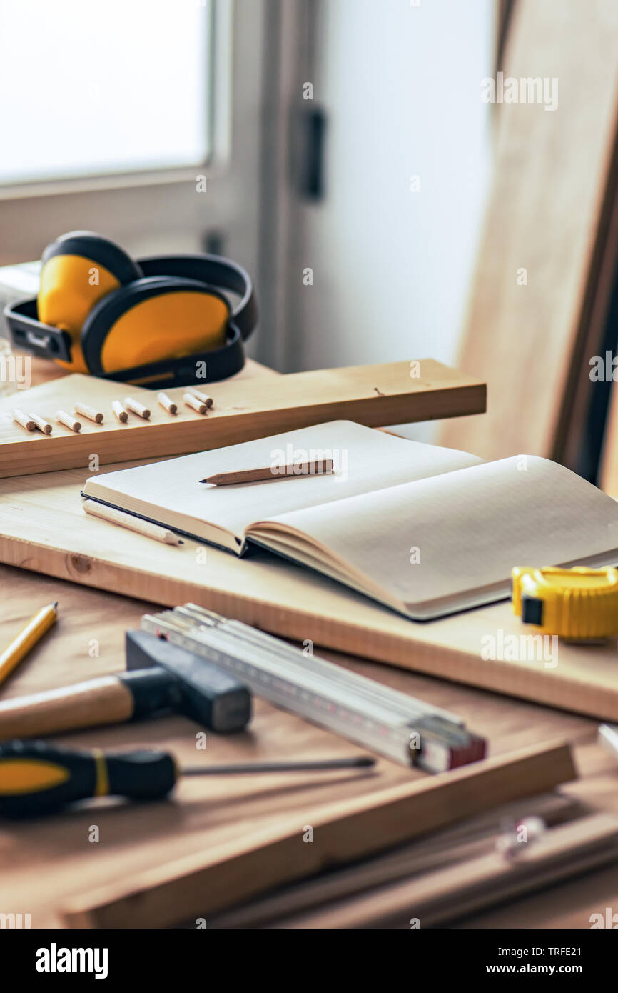 Various tools on carpentry woodwork workshop desk, selective focus with shallow depth of field Stock Photo
