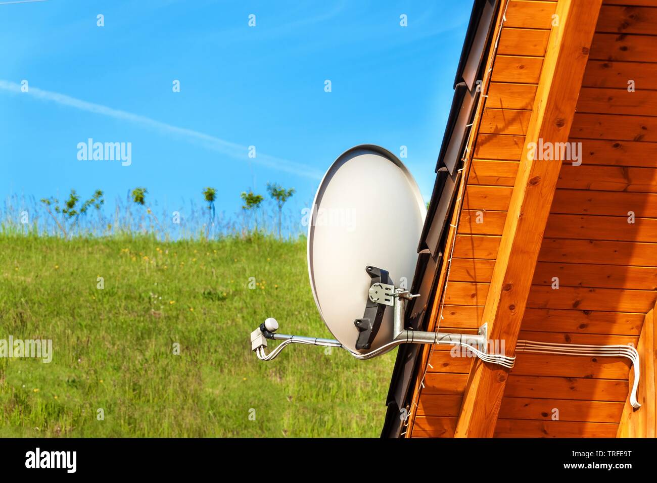 Satellite Tv Antenna On A Wooden House Tv Signal Transmission Internet Access Telecommunication Means Stock Photo Alamy