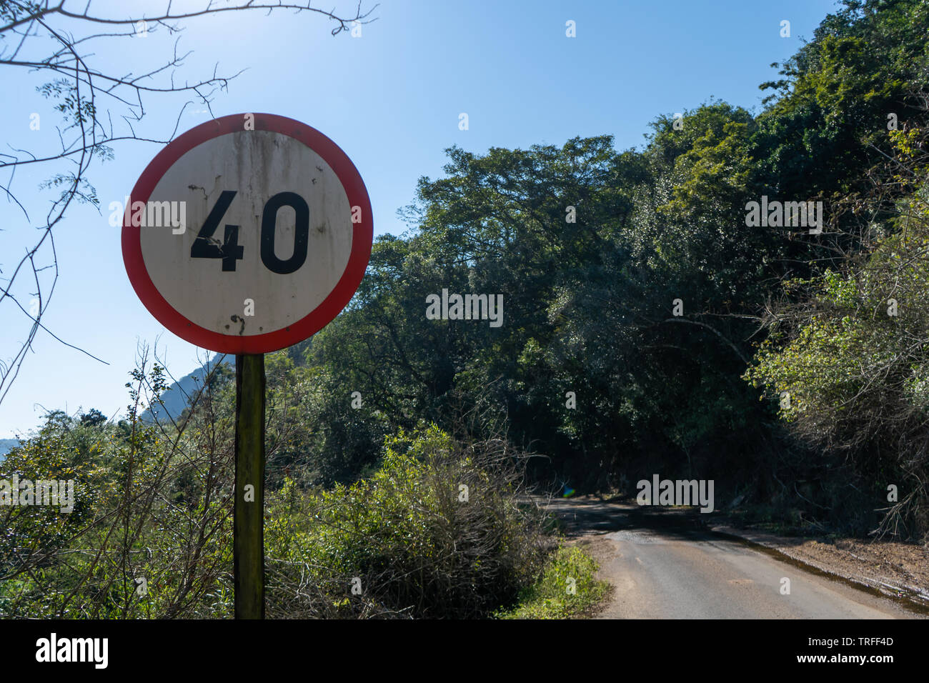 Old, Worn 40km/h Speed-Limit sign on a scenic road in South Africa. Stock Photo