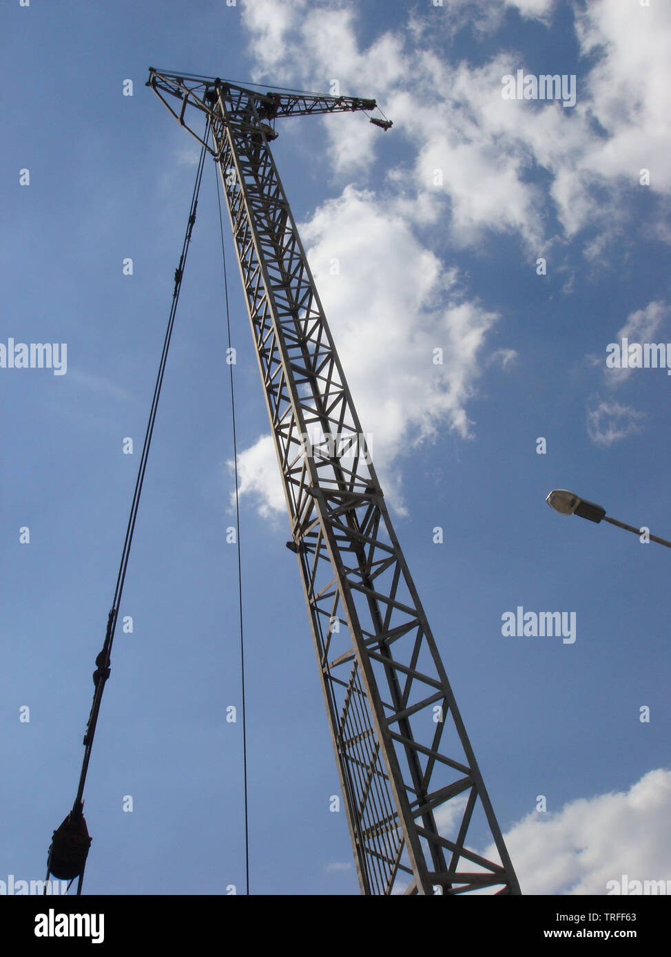 Abstract Industrial background with construction crane on blue sky ...