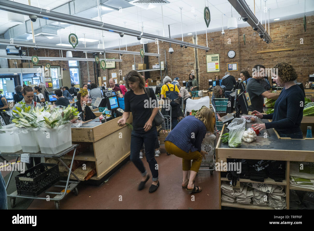 Shoppers at checkout counters at the always busy Park Slope Food Coop in Park Slope, Brooklyn, New Yortk. Stock Photo