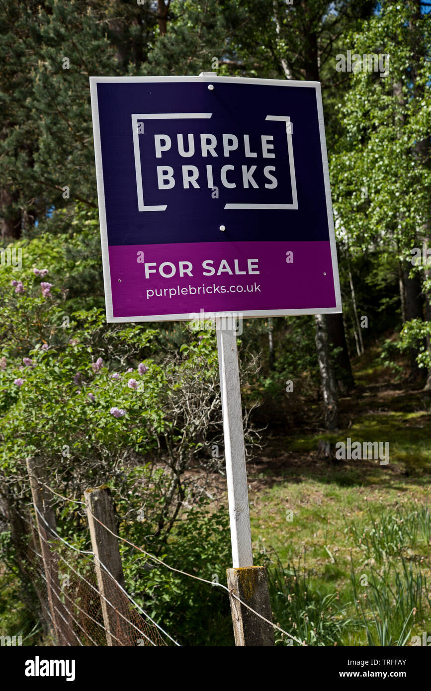 Purple Bricks 'for sale' sign in a rural setting in near Newtonmore