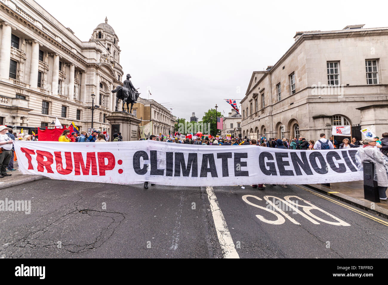 Trump climate genocide protest banner held by protesters during US President Donald Trump State Visit 2019. Whitehall, London, UK. Demonstration Stock Photo