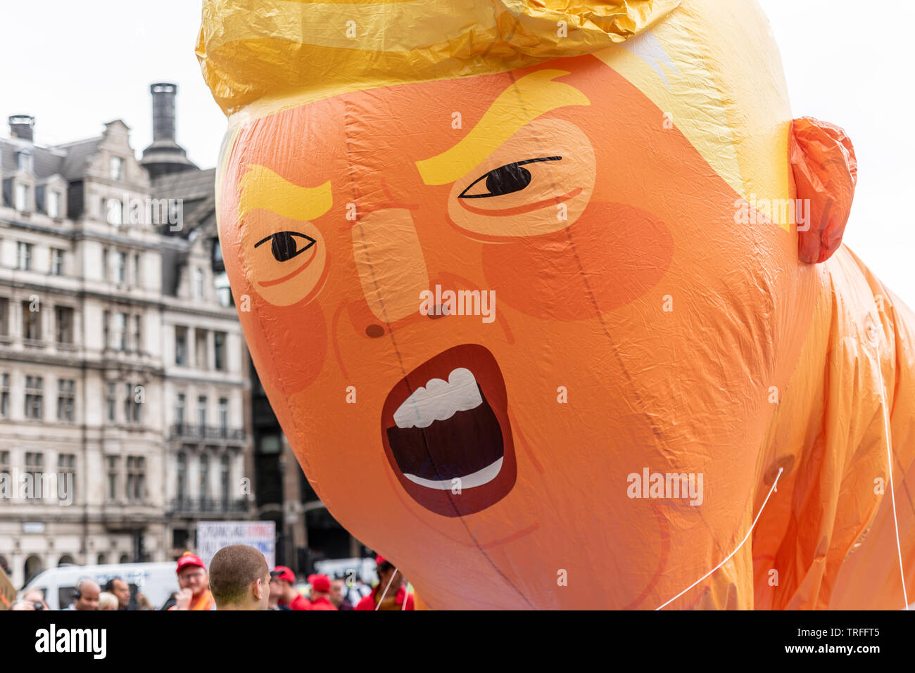 Donald Trump baby blimp balloon in Parliament Square, London, UK during US President State Visit. Face during inflation. Angry appearance Stock Photo