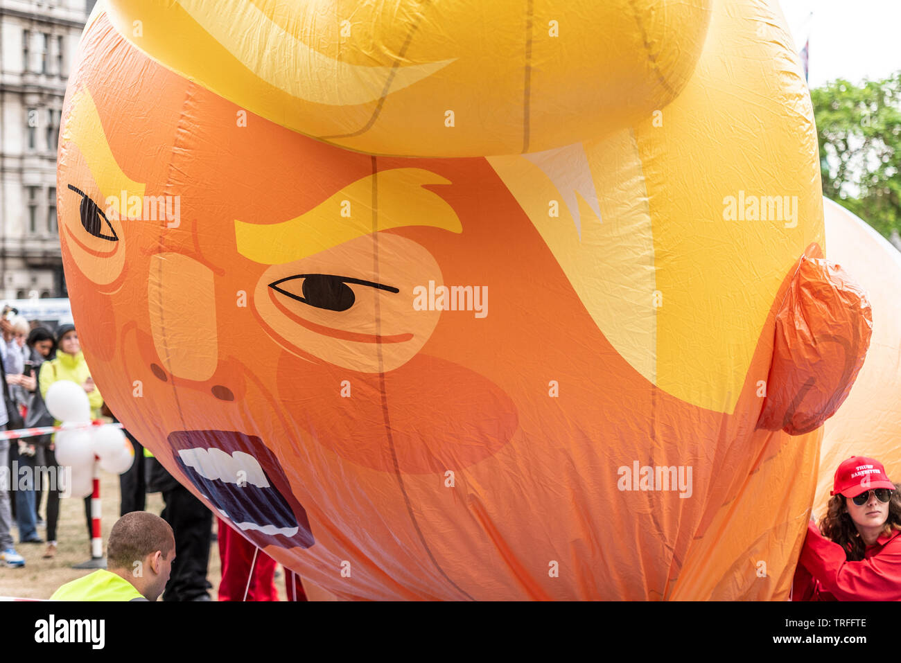 Donald Trump baby blimp balloon in Parliament Square, London, UK during US President State Visit. Face during inflation. Angry appearance Stock Photo