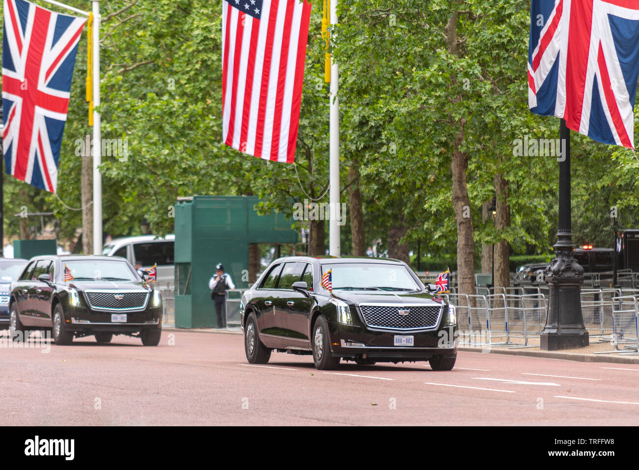 US President Donald Trump being driven along The Mall, London, UK in The Beast car with few people watching. No fans. Presidential motorcade Stock Photo