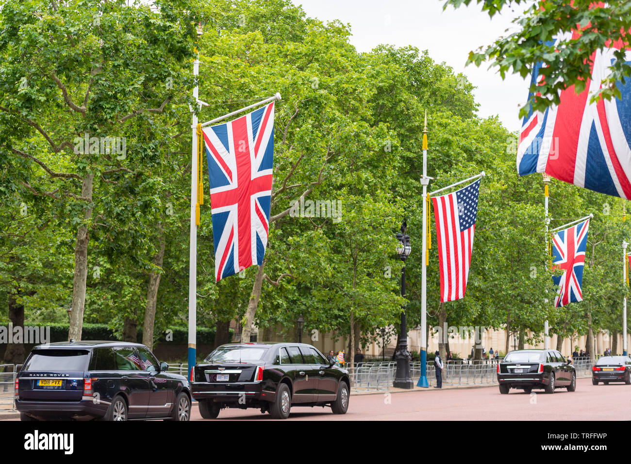 US President Donald Trump being driven along The Mall, London, UK in The Beast car with few people watching. No fans. Presidential motorcade Stock Photo