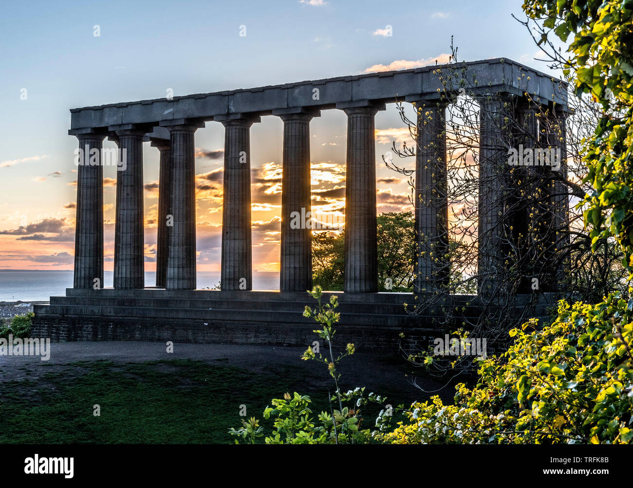 National Monument of Scotland pillars, Calton Hill, Edinburgh at sunrise. Stock Photo