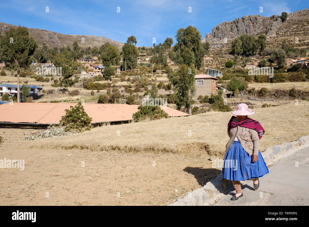 Local woman walking in Amantani Island, Puno Region, Peru Stock Photo
