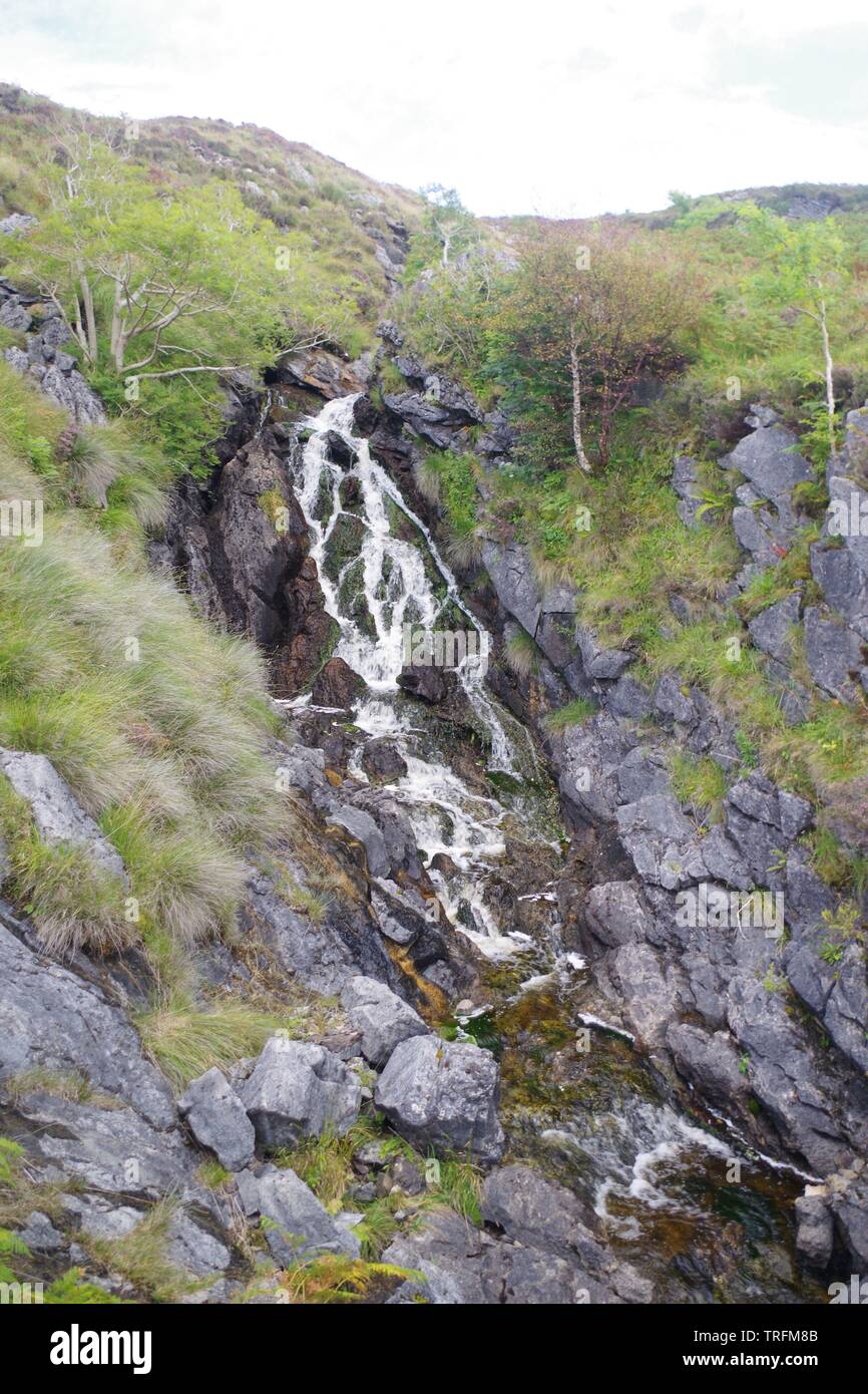 Highland Burn Waterfall Flowing in a Gully through Middle Jurassic Lias