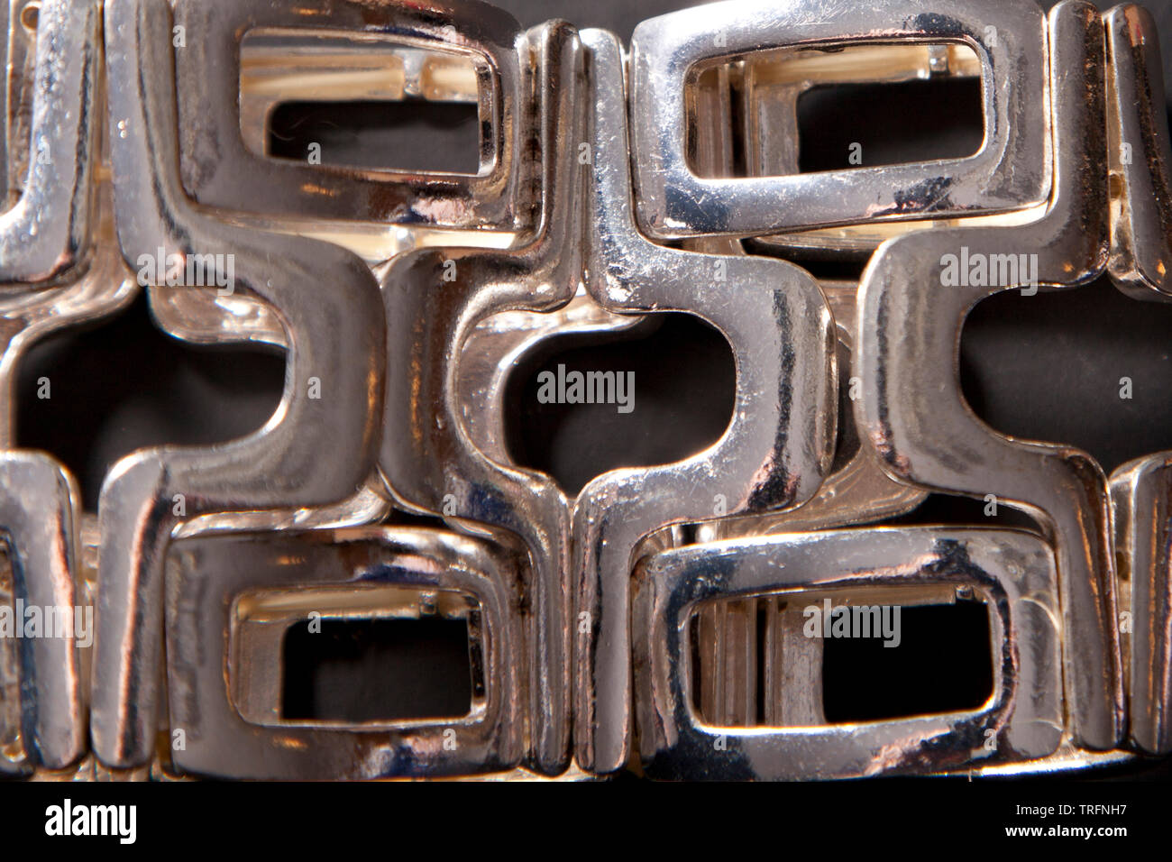 Interesting pattern on a silver wrist bracelet Stock Photo